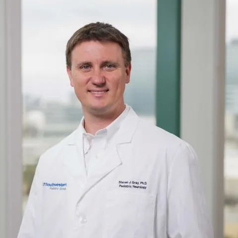 Portrait of Dr. Steven J. Gray in a white coat